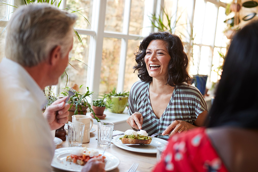 Laughing,Woman,Laughing,With,Male,Friend,At,A,Cafe,,Close Should I combine my pensions into one pot?