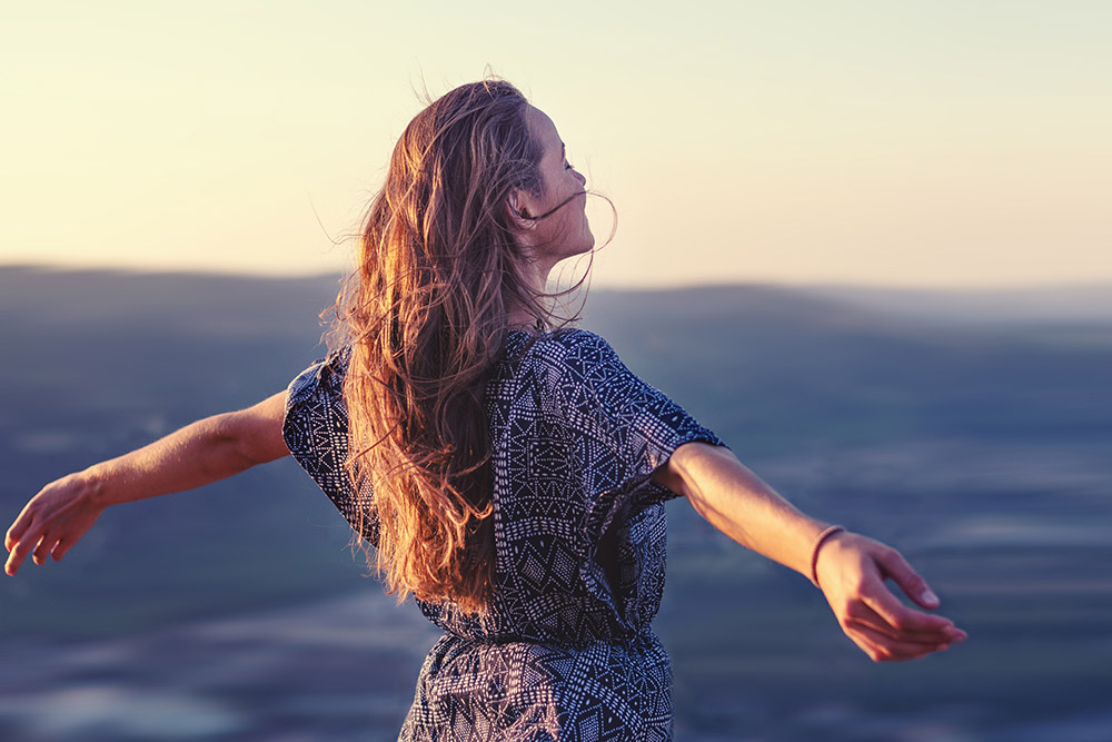 Christian worship and praise. A young woman with her hands raise Should I combine my pensions into one pot?