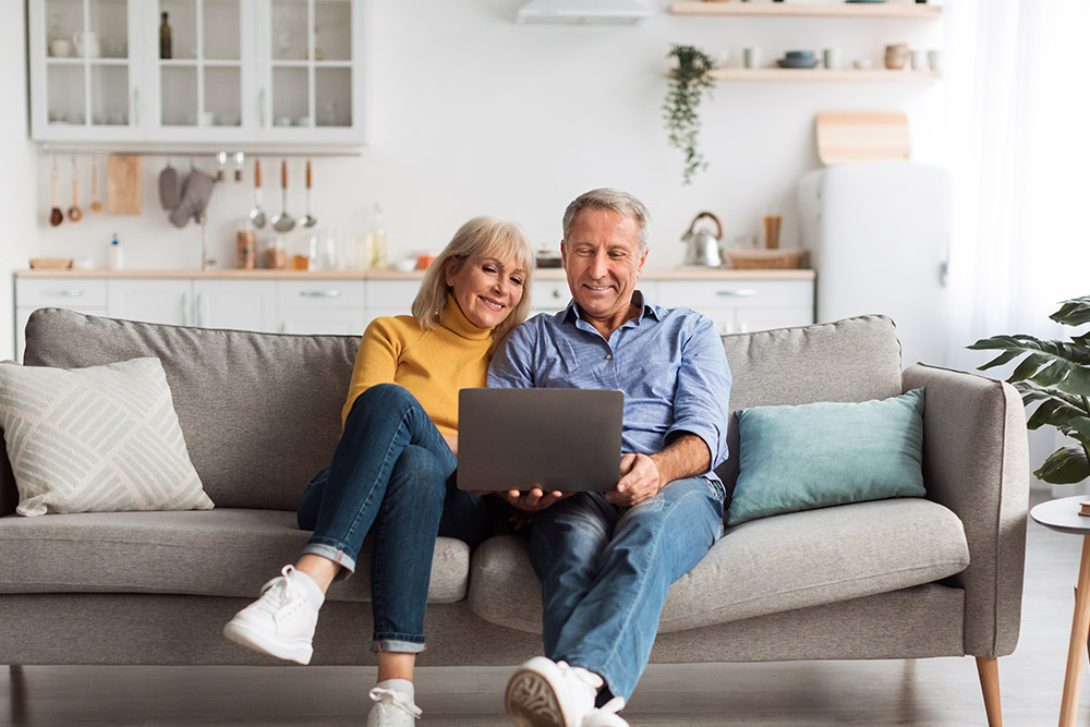 Senior,Spouses,Using,Laptop,Watching,Movie,Together,Sitting,On,Couch Should I combine my pensions into one pot?