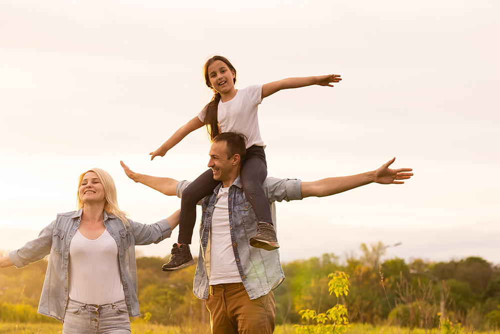 Young happy family in a field Should I combine my pensions into one pot?