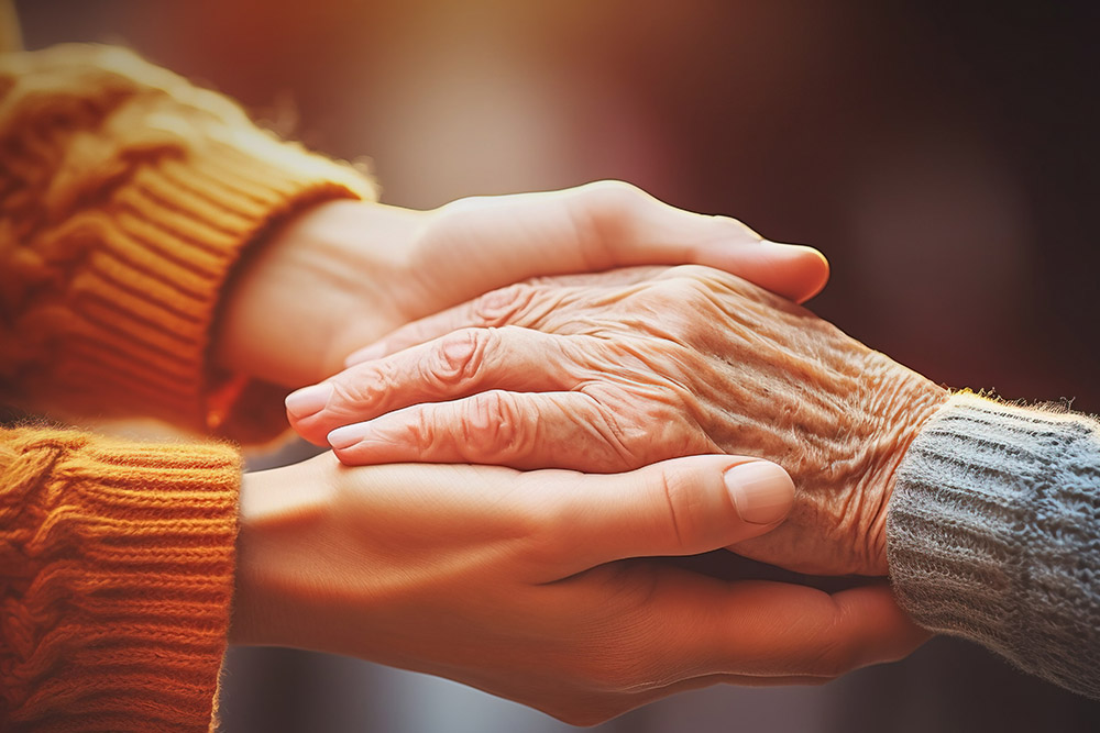 Taking care of the elderly concept with young woman holding the Should I combine my pensions into one pot?